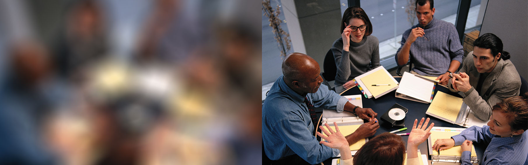 Photograph of employees having a meeting