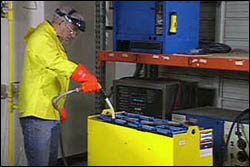 Figure 9. Water is added at the end of the charge by operator wearing PPE.