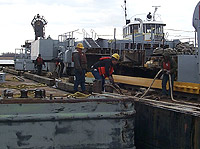 Figure 7: Barge secured alongside dock so workers can safely access it without using a gangway.