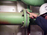Figure 4: Marine Chemist verifies that piping is secured