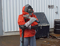 Figure 5: Abrasive blaster with appropriate PPE