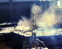 Figure 10: Abrasive blaster on barge creating large dust cloud