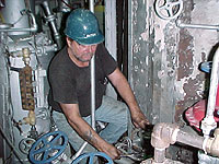 Figure 1: Boilermaker working on boiler piping system