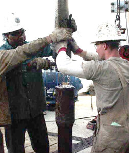 Figure 13. Applying pipe dope to a connection