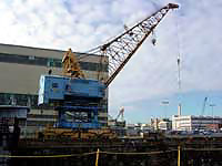 Figure 1: Portal Crane with idle slings on hook