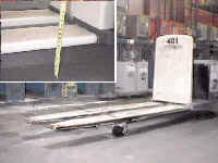 Pallet jack with higher than normal fork elevation