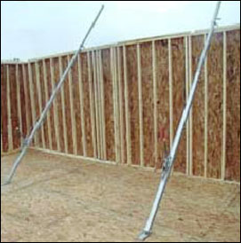 Figure 23 - Framed walls being erected using a jack. For problems with accessibility in using figures and illustrations, please contact the DOC at 202-693-2020.