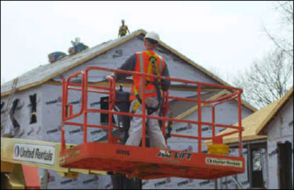 Figure 31 - Worker positioning an aerial lift. For problems with accessibility in using figures and illustrations, please contact the DOC at 202-693-2020.