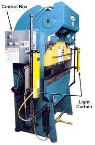 Side view of a hydra-mechanical press with labeled control box and light curtain