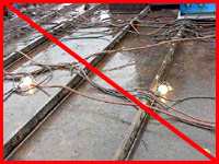 Figure 2: Improper practice - Ship must be grounded while in dry dock to minimize electric shock hazards