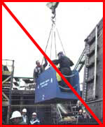 Figure 9: Improper practice - Man basket used without tag line or personal fall protection, and with an improperly guarded open side