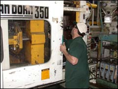 Figure 1. Employee opening operator's gate.