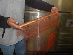 Figure 12. Holding a flexo plate with fingers relaxed alleviates stress on the hands.