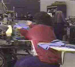 Fig. 3 Reaching to the side to place fabric.