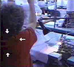 Fig. 2 Reaching overhead to place fabric.