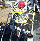 Figure 5: Unsafe ladder being marked with barrier tape.