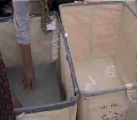 Fig. 3 Reaching into cart.