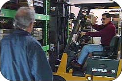 Figure 1. Operator cautioning pedestrian to stop.