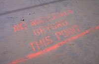 Warning Sign Stating: "No Materials Beyond This Point."
