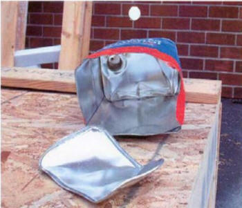 Photo #2: Gallon can of alcohol showing damage from the explosion.